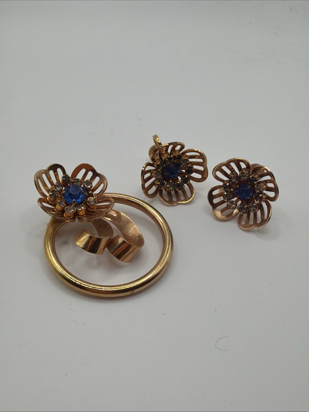 Gold Floral brooch and earrings Set with Blue Crystal Centers